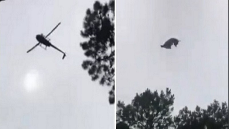El helicóptero sobrevolando la pileta sobre la cual arrojaron el animal.