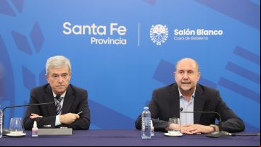 El ministro de Economía, Walter Agosto, y el gobernador Omar Perotti.